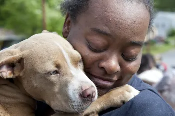 Woman holding a dog